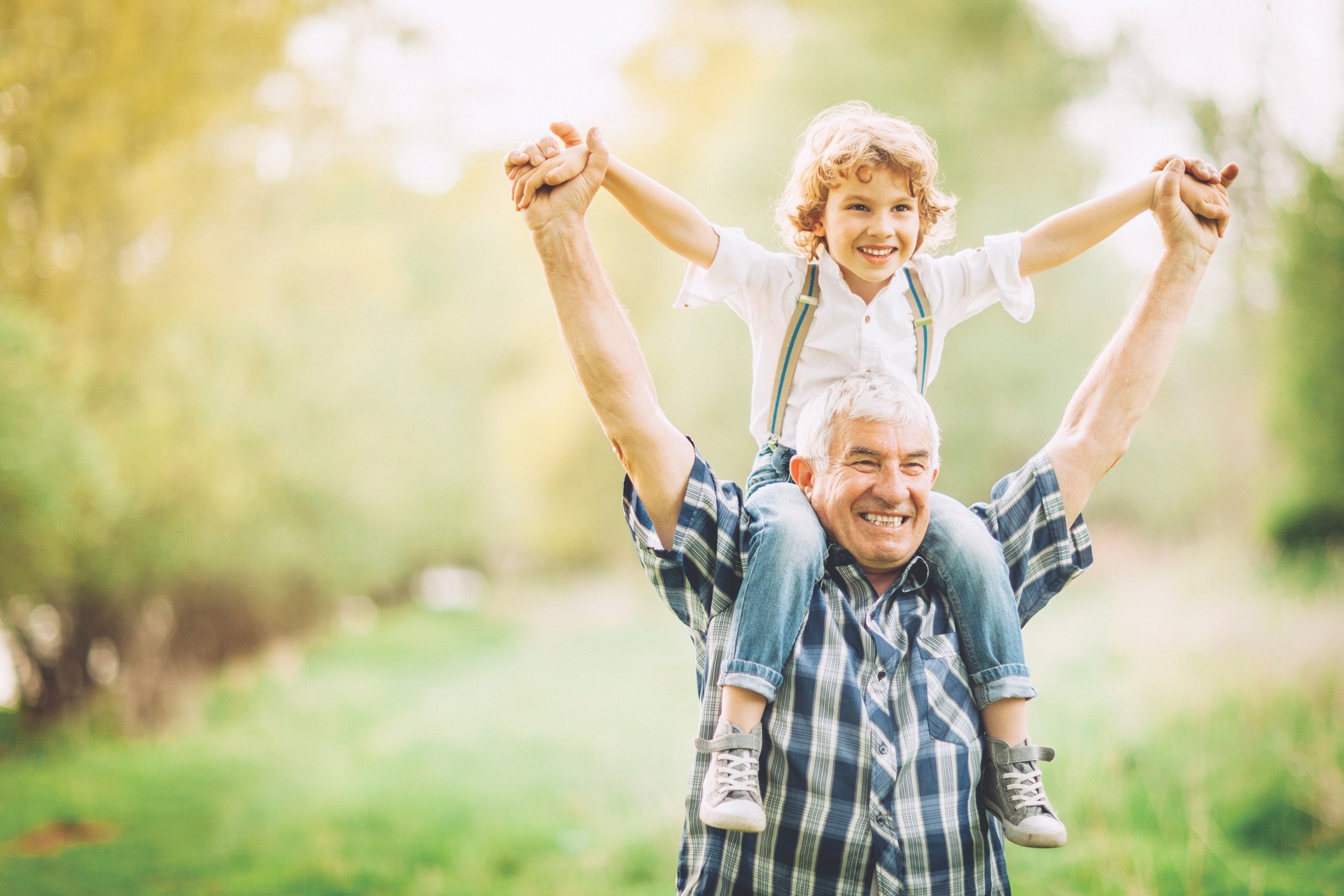 Grandchild on grandpas shoulders
